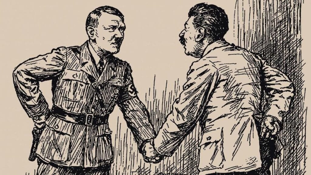 Hitler y Stalin se dan la mano ignorando el mapa de Polonia y repartiendose Europa