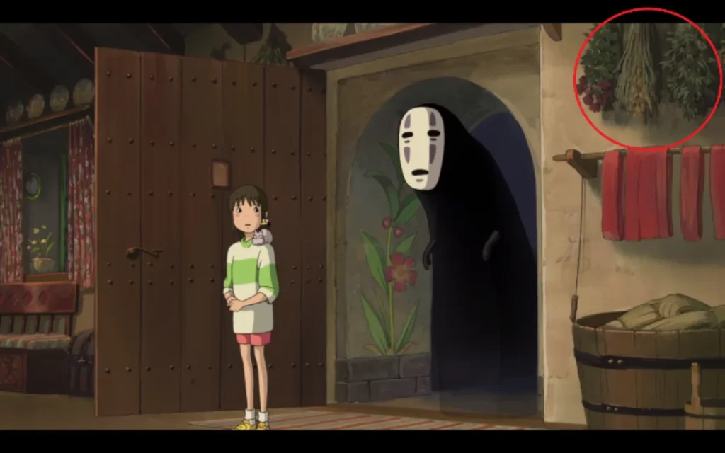 Chihiro en la casa de Zeniba con Sin Cara al fondo